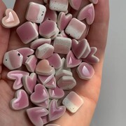 handful of pink ceramic stud earrings 