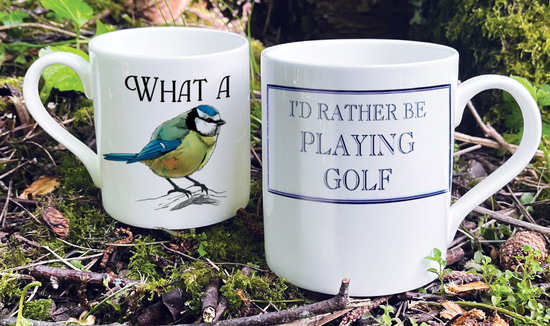 Two Bone China Mugs, one reading I'd Rather Be Playing Golf and the other What A Tit, with a picture of a blue tit in place of the word tit. 