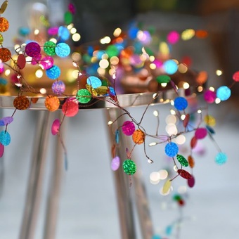 Brightly coloured beaded shimmery battery or mains fairy lights for indoor spaces