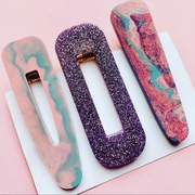 Photograph of 3 marble hair clips