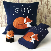 sleeping fox cushion and hot water bottle