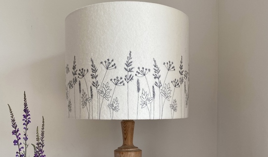 Freehand machine embroidered Hedgerow design lampshade stitched in dark grey.