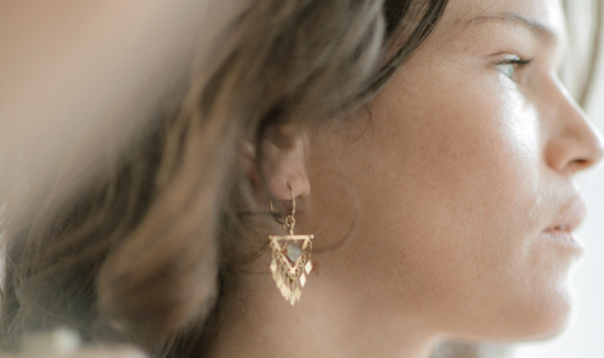 Woman wearing semi precious Jade earrings