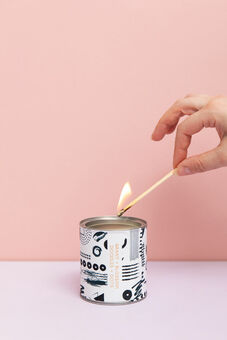 Doodles + Dots collectable candle being lit
