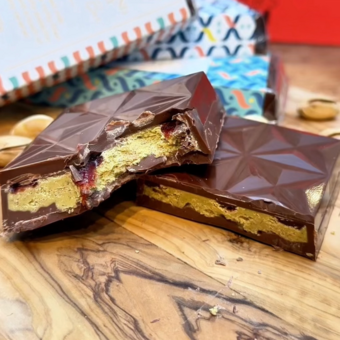 Close up on our Signature Chocolate Bar - Pistachio and Raspeberry chocolate bar