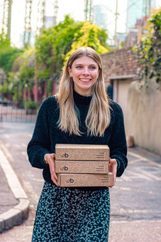 founder holding boxes