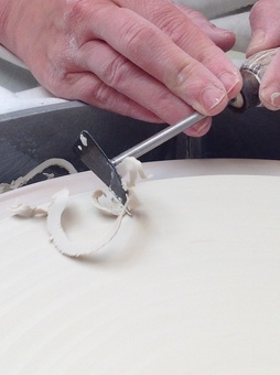 Turning a porcelain plate