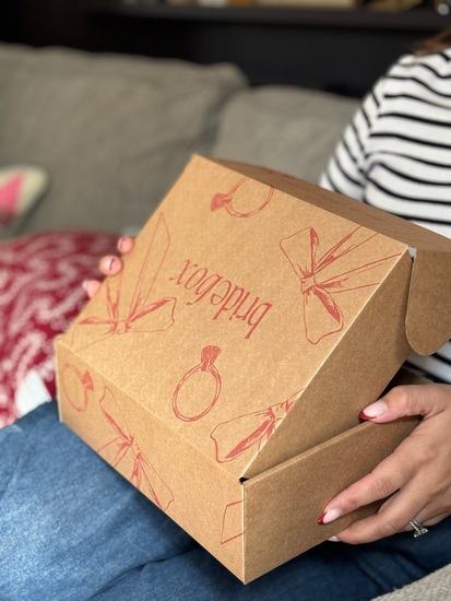 A close up image showing a Bridebox subscription box.