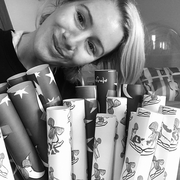 Meg with wrapping paper rolls