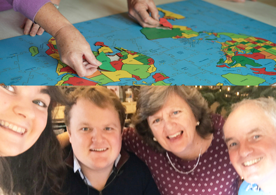 Two People putting together the Map of the World Jigsaw Puzzle. Below an image of the 4 members of Heirloom Puzzles Family